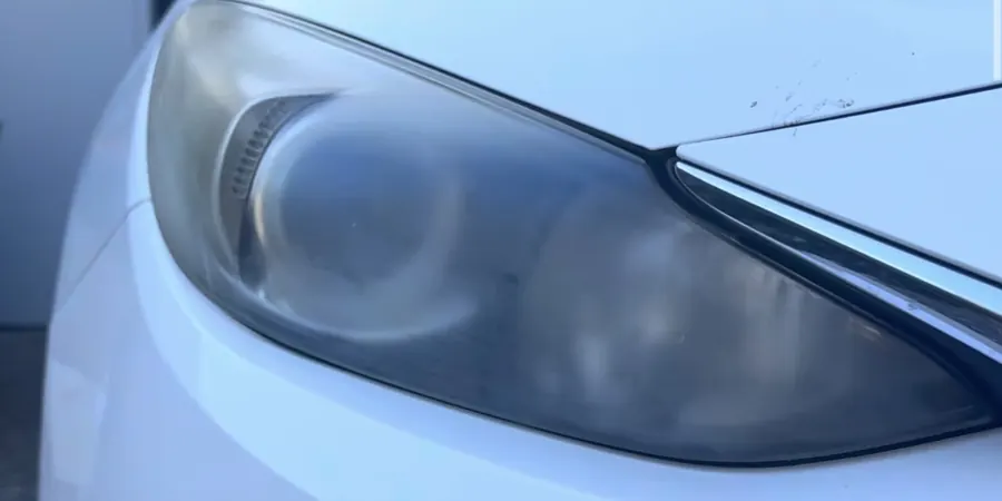 Headlight before: hazy, faded lens
