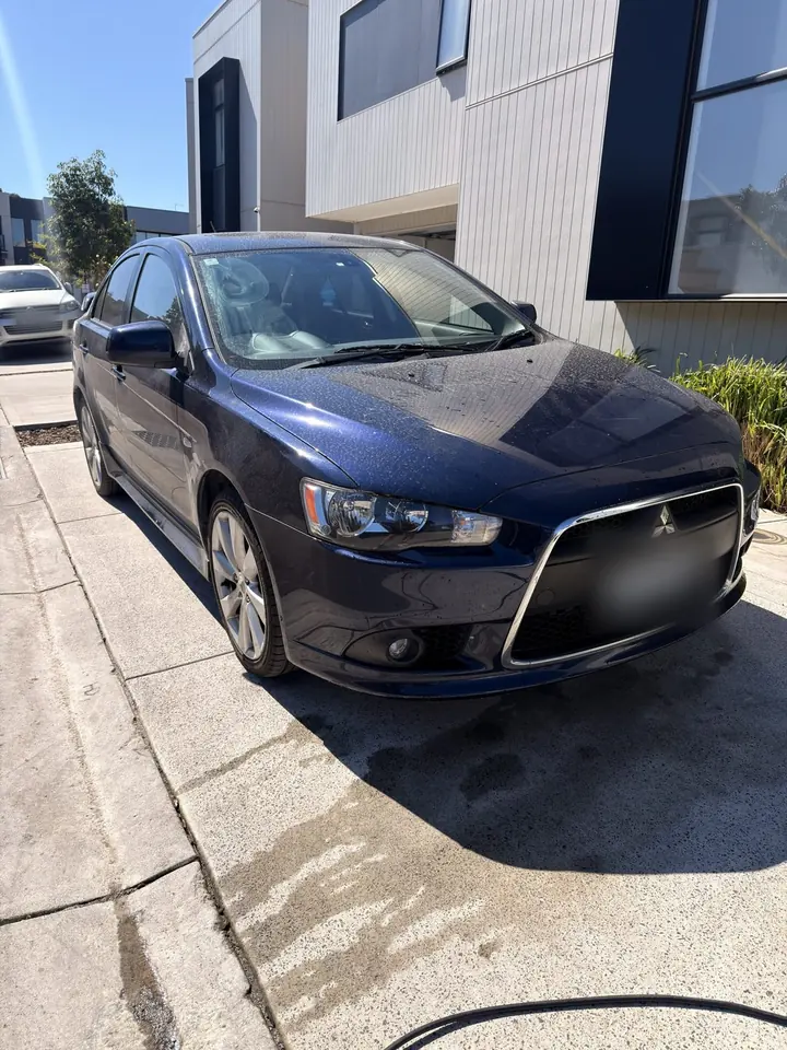 Mitsubishi Lancer before: dusty paint covered in dried water spots