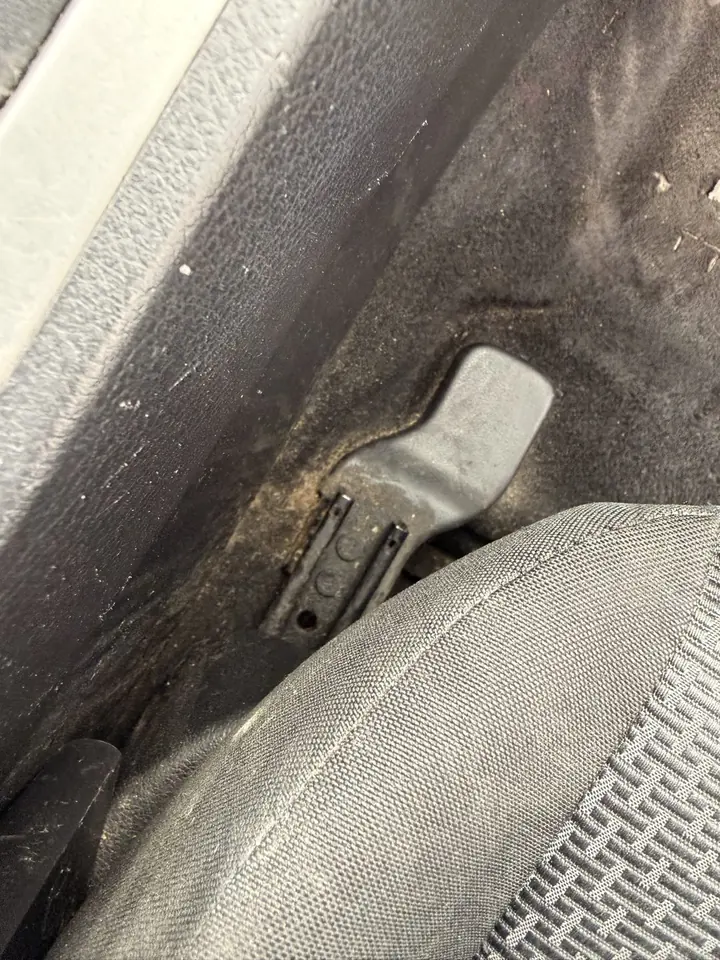 Mazda 3 before: dirt and grime built up around the seat rail